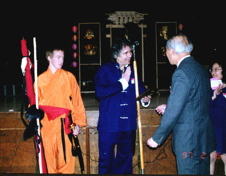 Buddha Zhen with Monk Spade accepting award from Chinese Association President.
